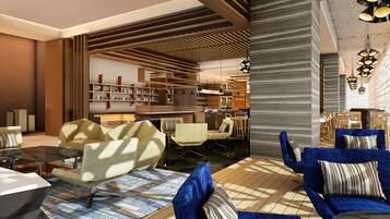A modern interior with sofas, a coffee table, and a bookshelf.