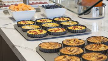 Daily buffet breakfast (USD 18 per person)