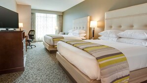 A hotel room with two beds, a TV, a desk, and a chair. - Drury Inn & Suites Pittsburgh Airport Settlers Ridge (Pittsburgh)