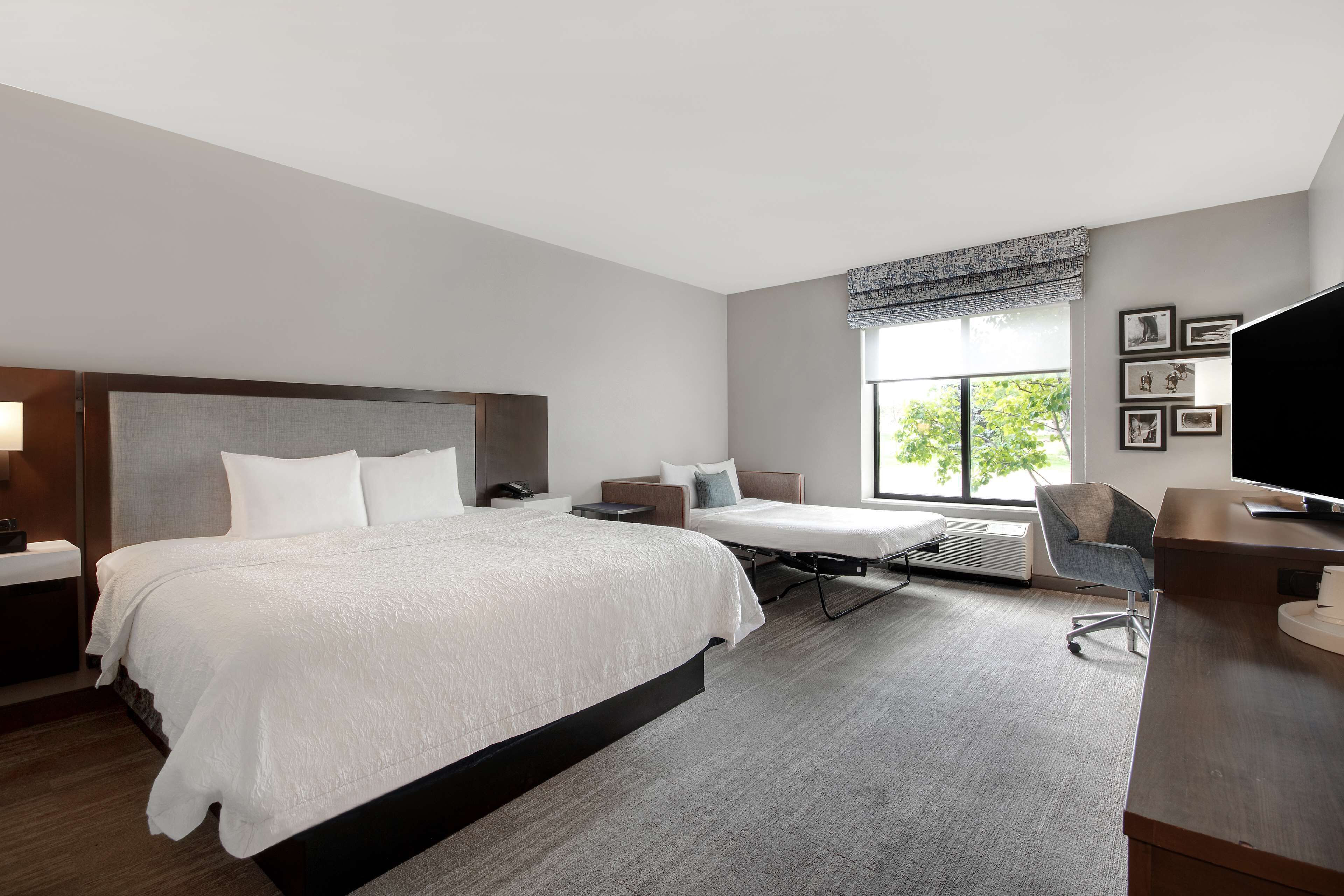 room, 1 king bed with sofa bed, refrigerator & microwave | desk, laptop workspace, blackout curtains, iron/ironing board