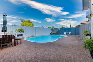 Outdoor pool, open 9:30 AM to 6:00 PM, pool umbrellas