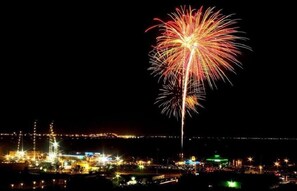 A nighttime cityscape with a prominent display of fireworks.