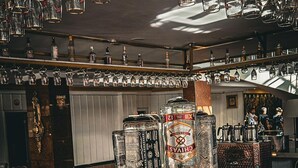 A bar area with a variety of bottles and glasses, including a prominent bottle of Chivas. - Malabadi Hotel (Diyarbakir)