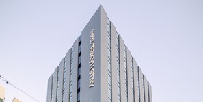 A modern building with a prominent vertical sign. - Tokyu Stay Sapporo (Sapporo)