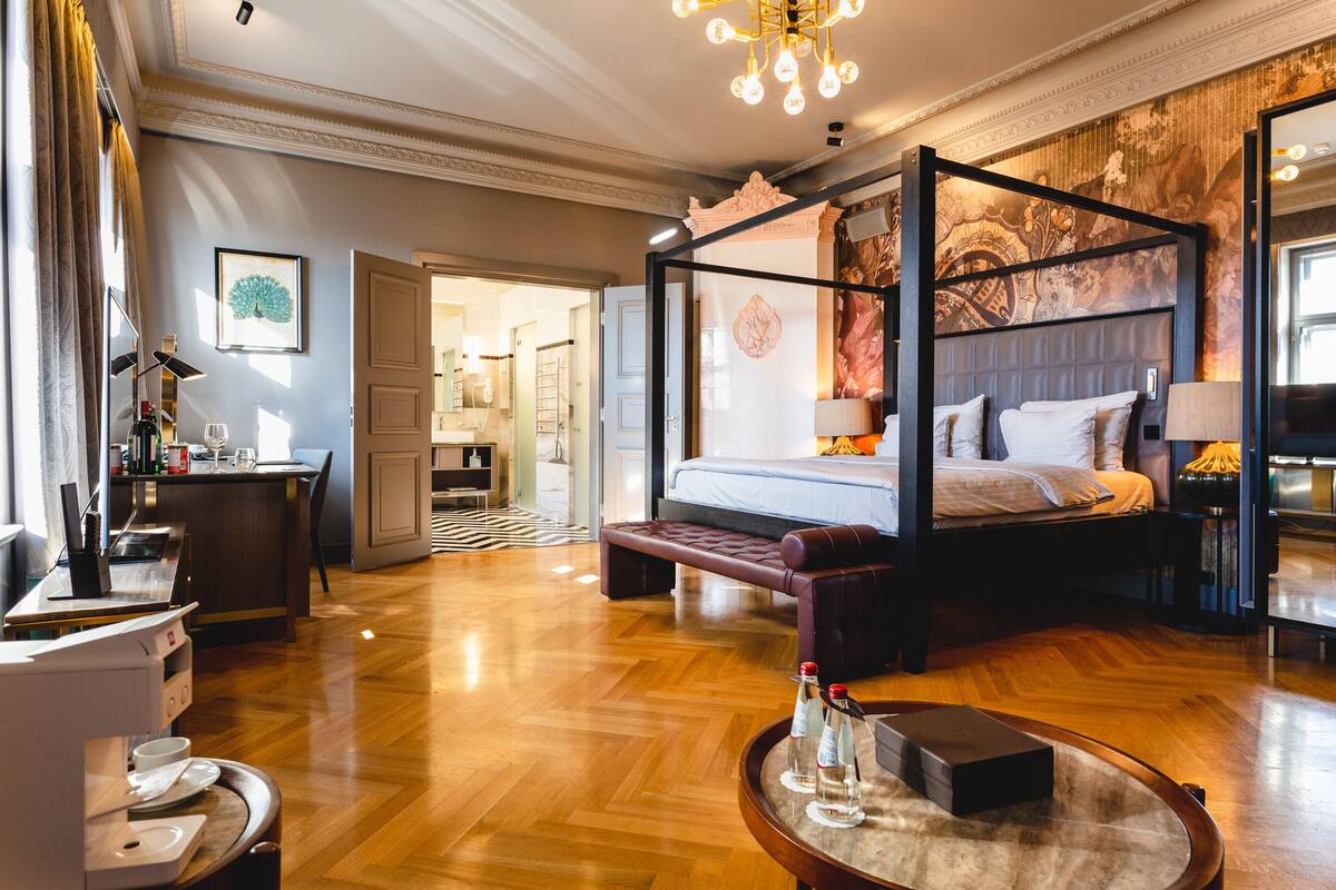 premium room, 1 king bed, non smoking, park view | minibar, in-room safe, desk, blackout curtains