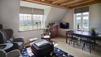 Suite, 1 Bedroom | Living room | Flat-screen TV