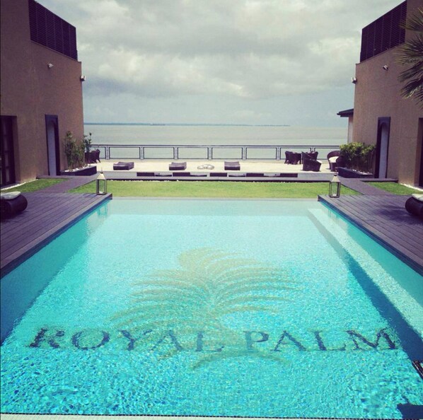 Outdoor pool, pool umbrellas, sun loungers