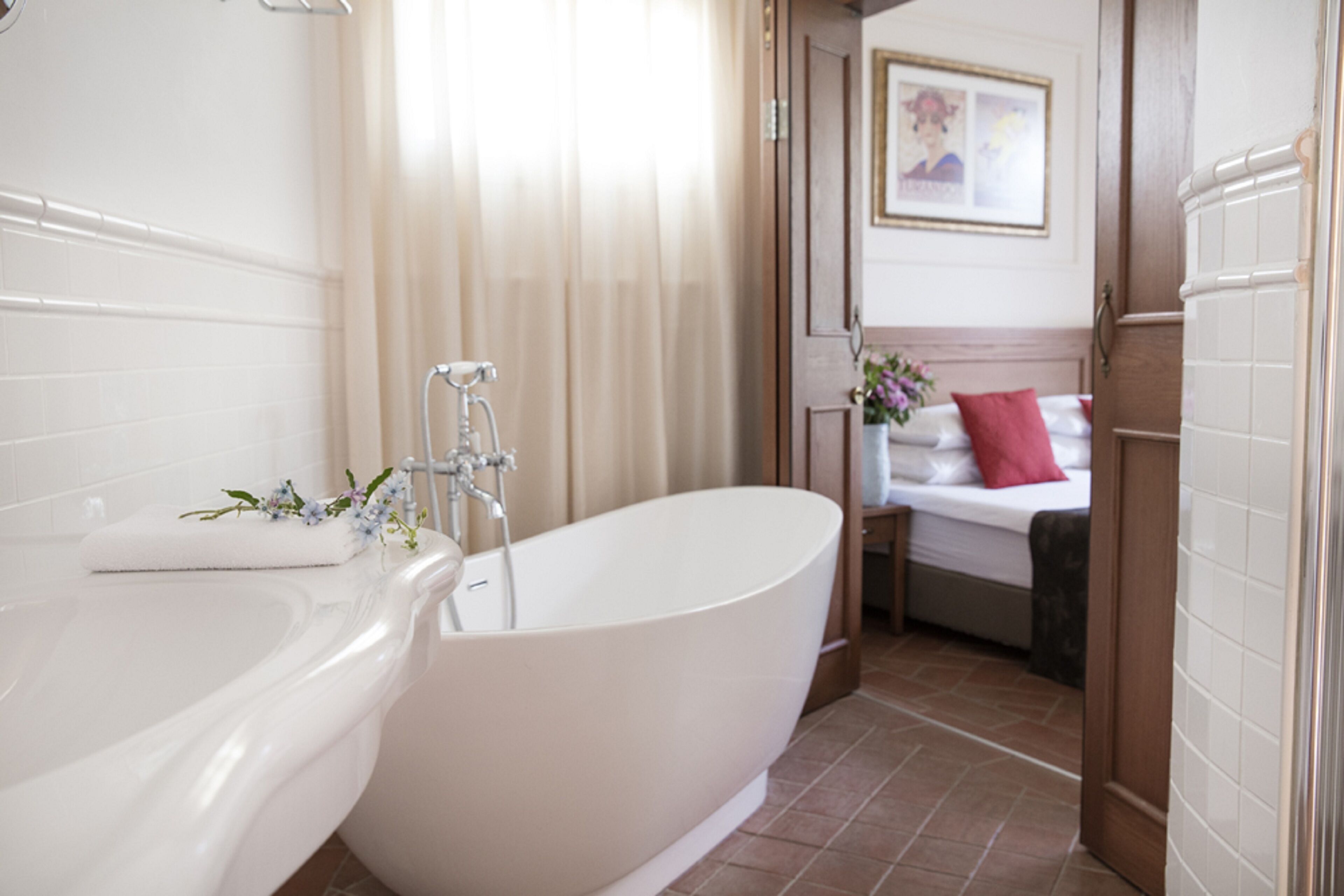 separate bathtub and shower, free toiletries, hair dryer, bathrobes