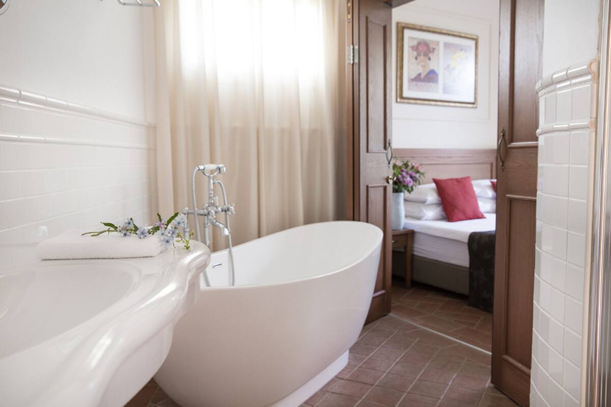 separate bathtub and shower, free toiletries, hair dryer, bathrobes