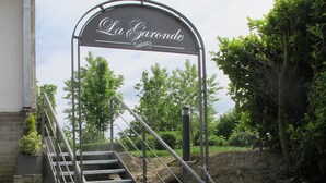 A staircase leading to a building entrance with a sign reading "La Garonde". - La Garonde (Berthen)
