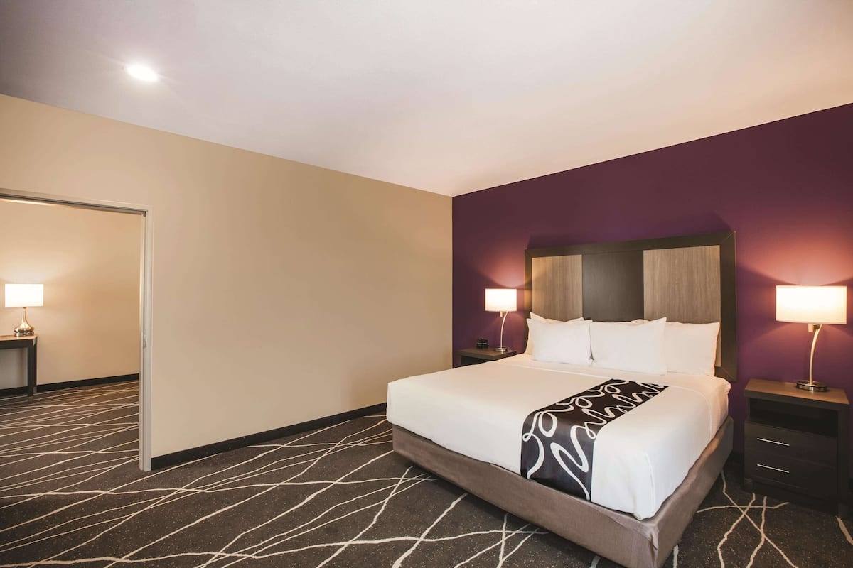 Premium bedding, desk, laptop workspace, iron/ironing board