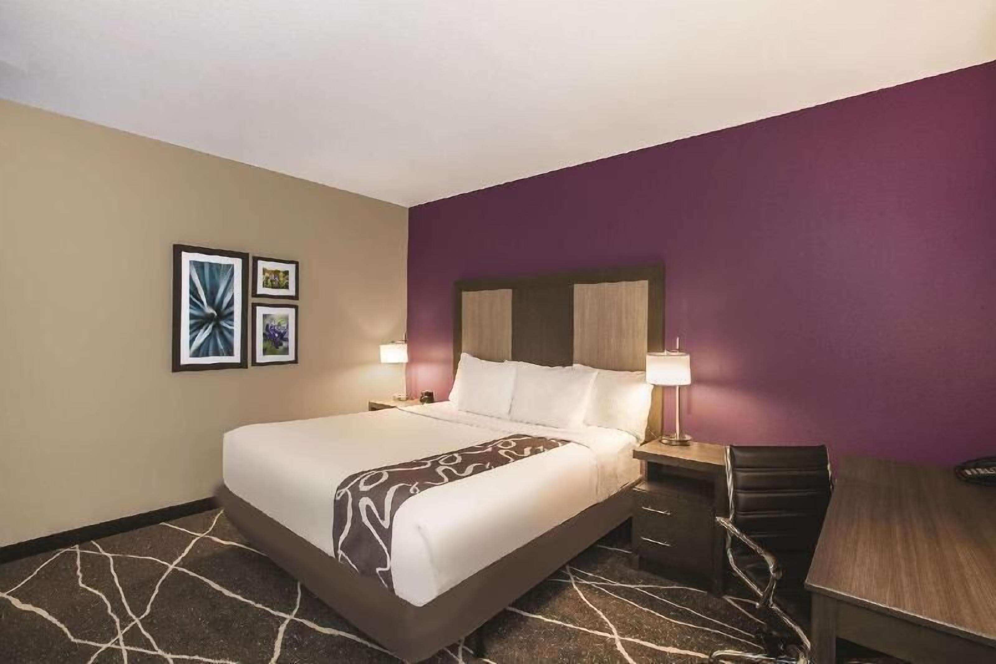 Premium bedding, desk, laptop workspace, iron/ironing board