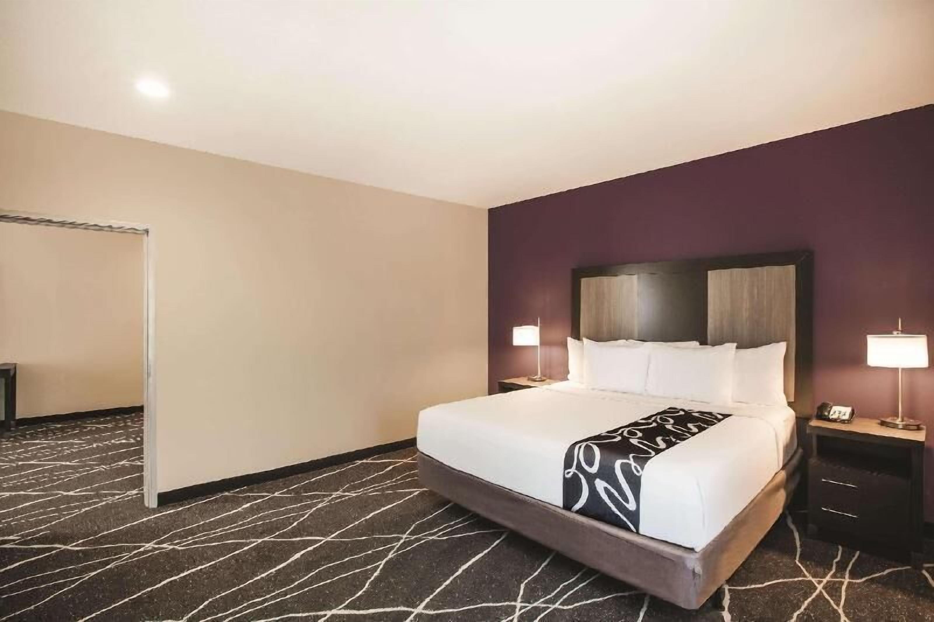 Premium bedding, desk, laptop workspace, iron/ironing board