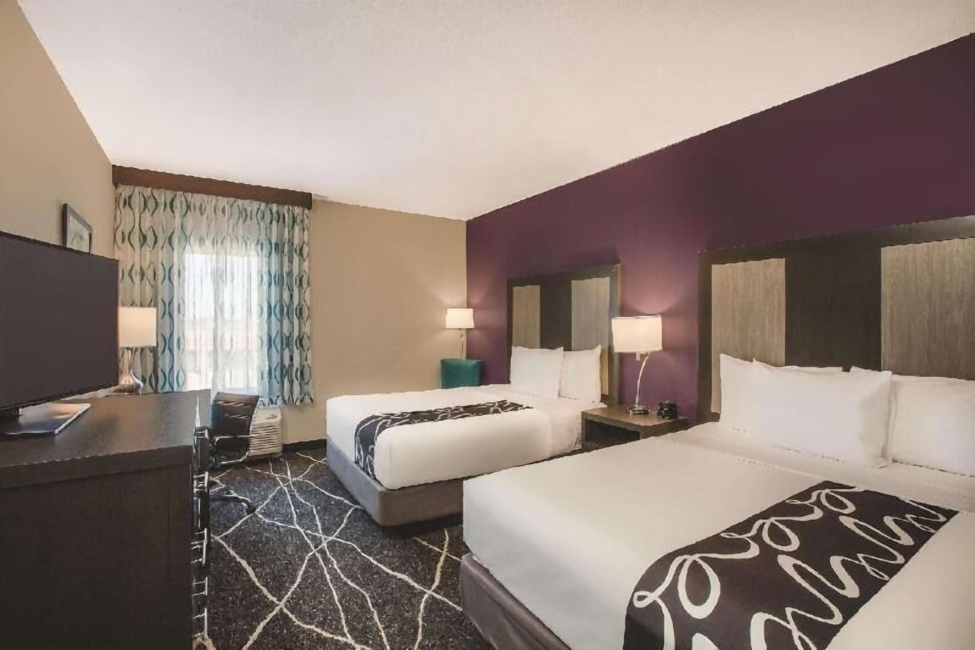 Premium bedding, desk, laptop workspace, iron/ironing board