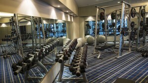 A gym with weightlifting equipment, mirrors, and exercise balls. - Yinchuan Vintage Hill Hotels & Resorts (Yinchuan)