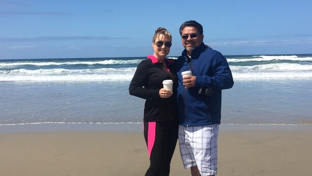 Two people standing on a beach with waves in the background. - 50% to Book Home - Super Clean 3BR- Sleeps 6- By TNT (Page)