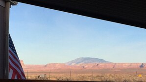 A wooden balcony with a view of a desert landscape and a mountain in the distance. - 50% to Book Home - Super Clean 3BR- Sleeps 6- By TNT (Page)