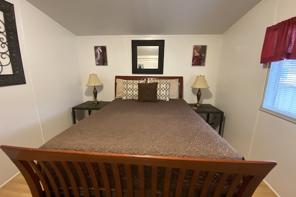 Queen bed in the master bedroom.