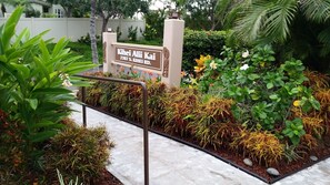 Stroll through the beautifully maintained garden at Kihei Ali Kai, surrounded by lush plants and shrubs.