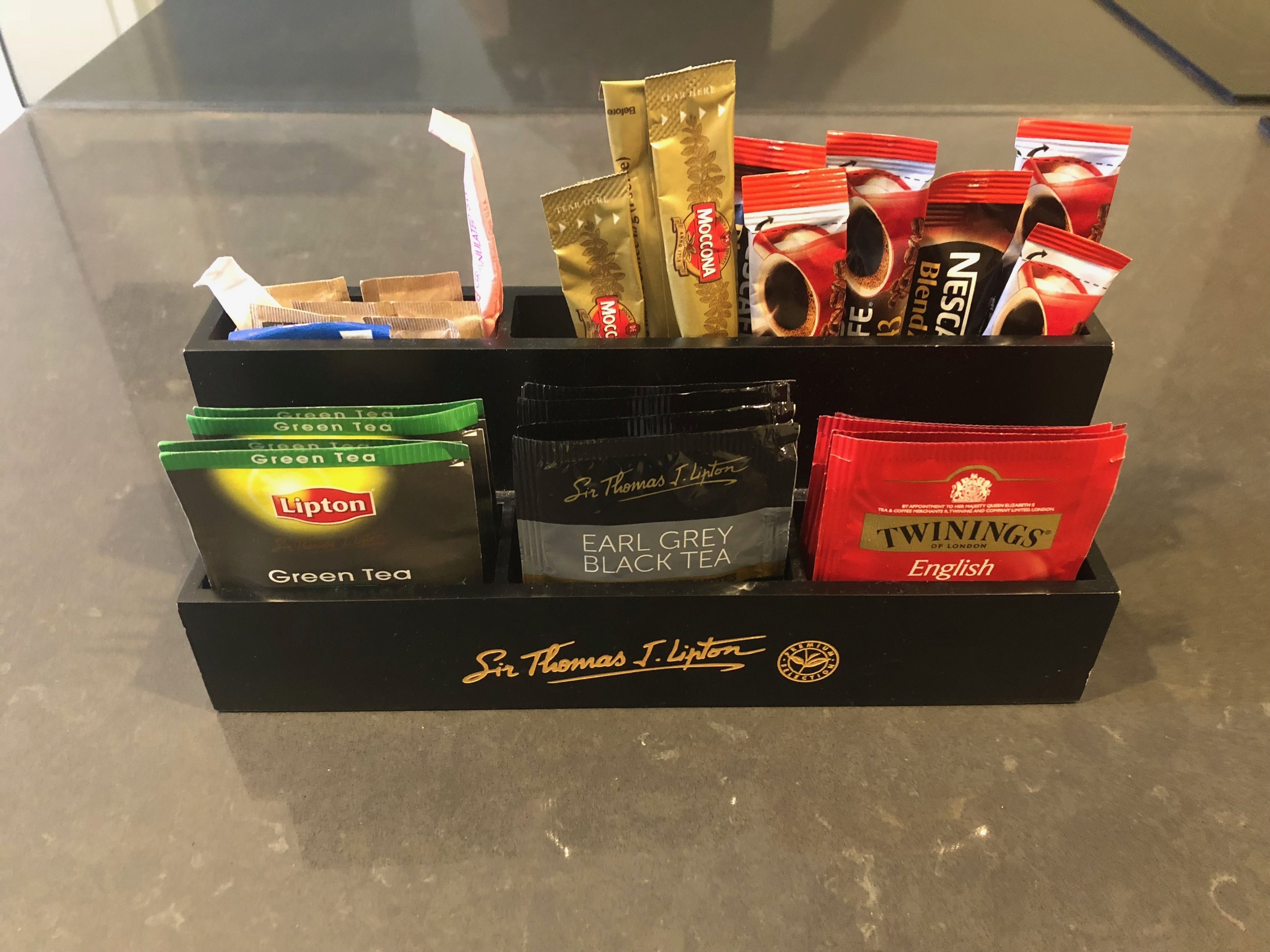 full-sized fridge, microwave, stovetop, coffee/tea maker