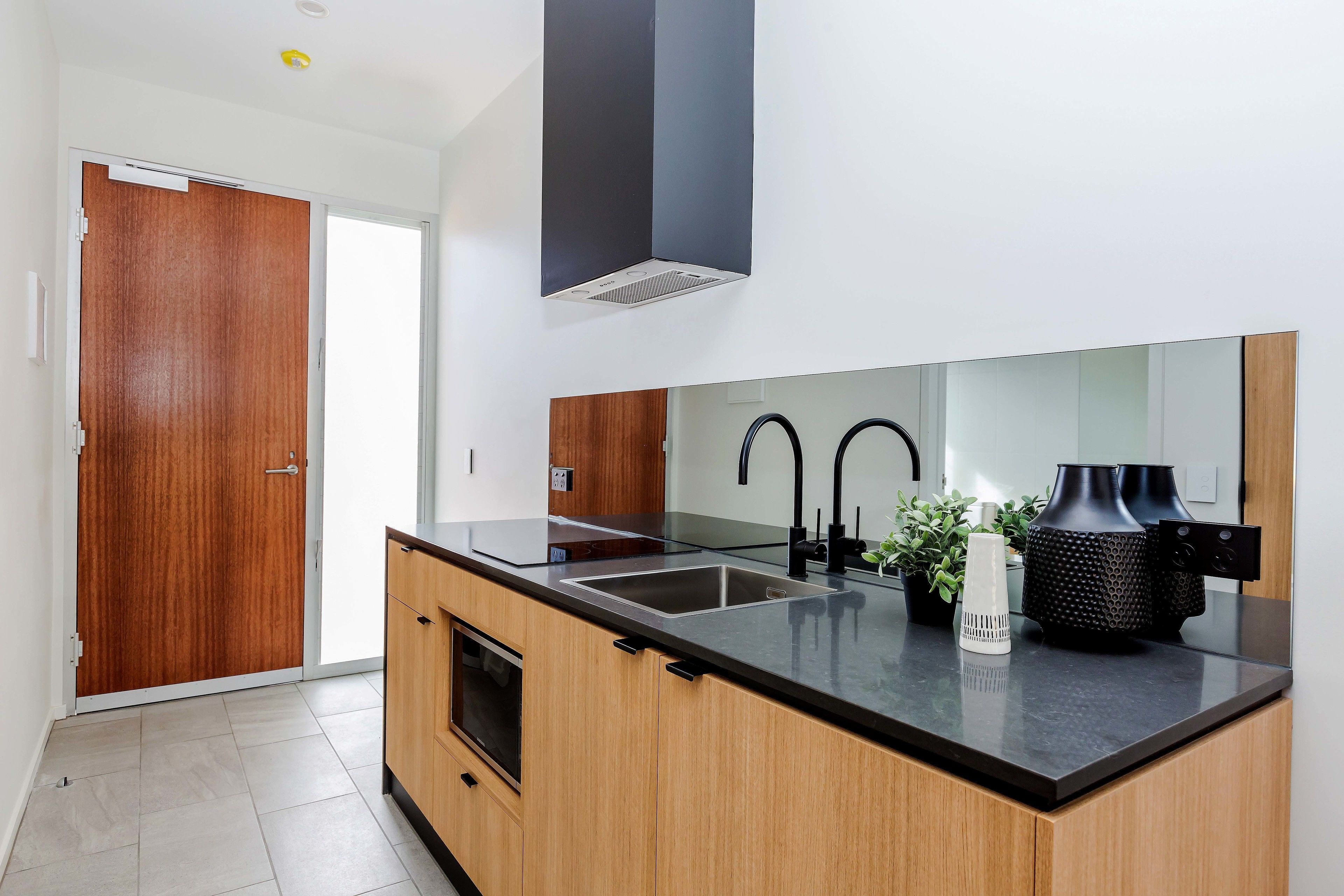 full-sized fridge, microwave, stovetop, coffee/tea maker