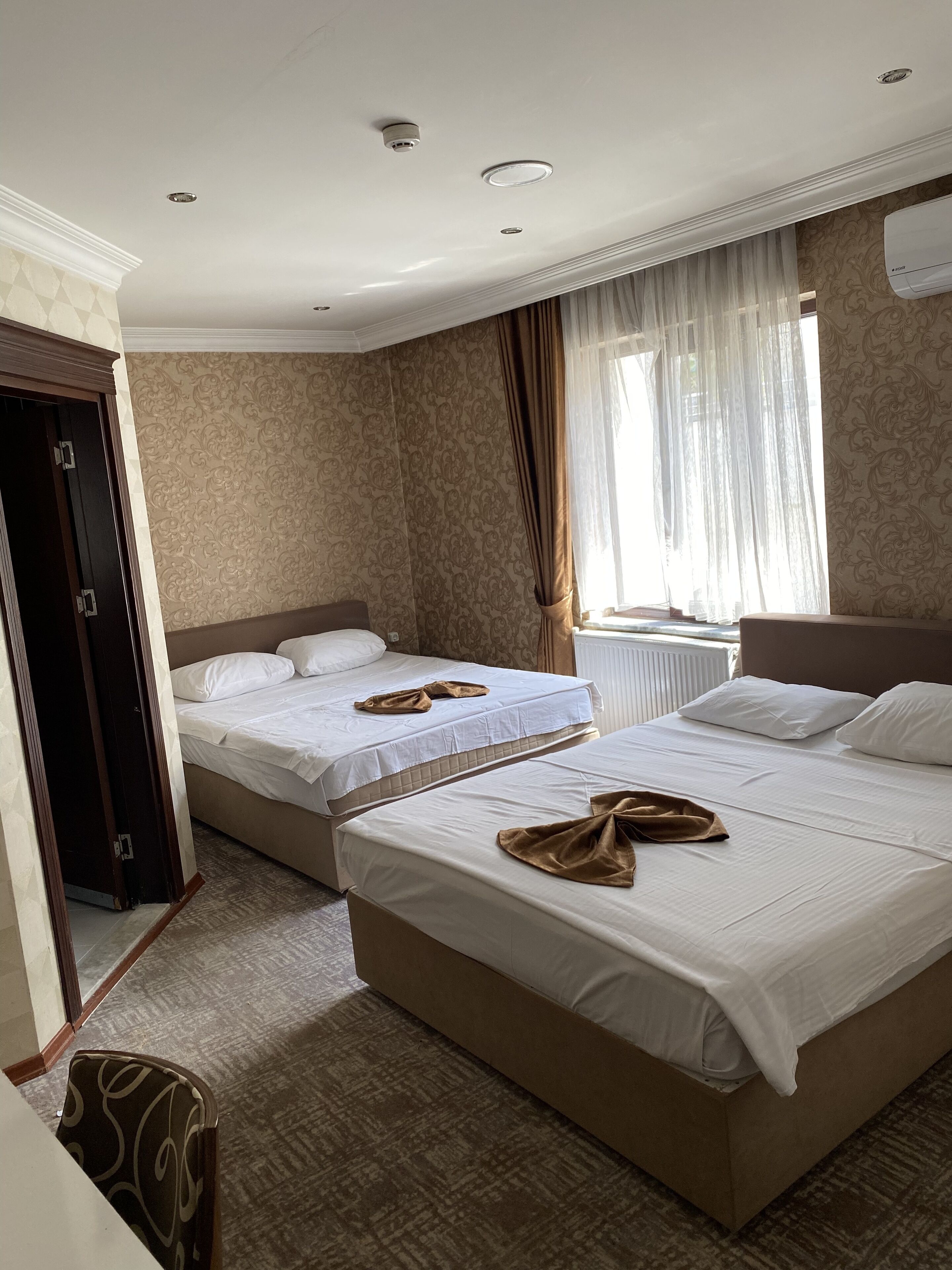 standard quadruple room, 1 bedroom, ensuite, city view | in-room safe, desk, soundproofing, iron/ironing board