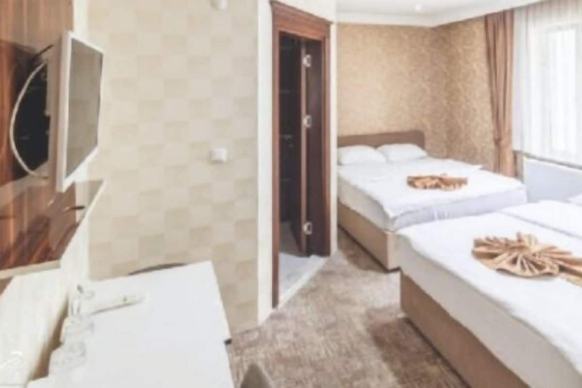 Standard Quadruple Room, 1 Bedroom, Ensuite, City View | 1 bedroom, in-room safe, desk, soundproofing