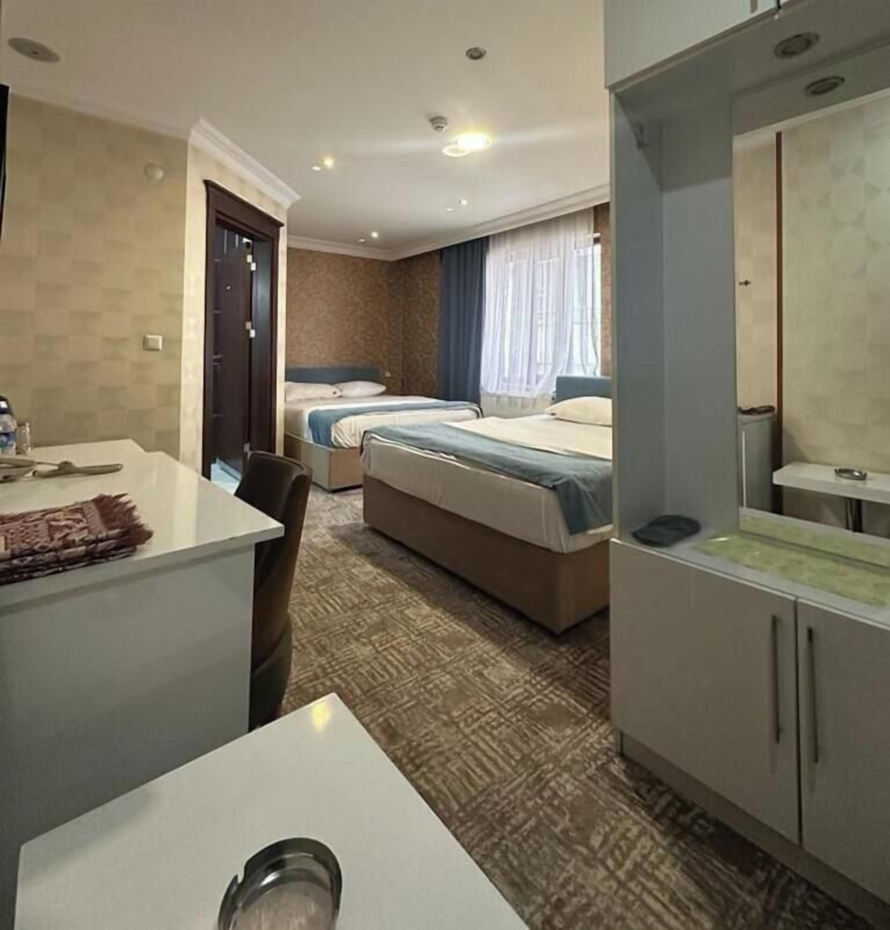 Standard Quadruple Room, 1 Bedroom, Ensuite, City View | In-room safe, desk, soundproofing, iron/ironing board