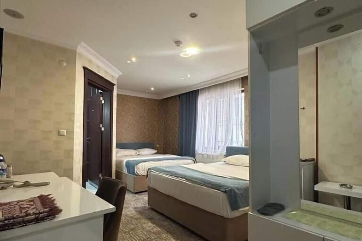 Standard Quadruple Room, 1 Bedroom, Ensuite, City View | 1 bedroom, in-room safe, desk, soundproofing