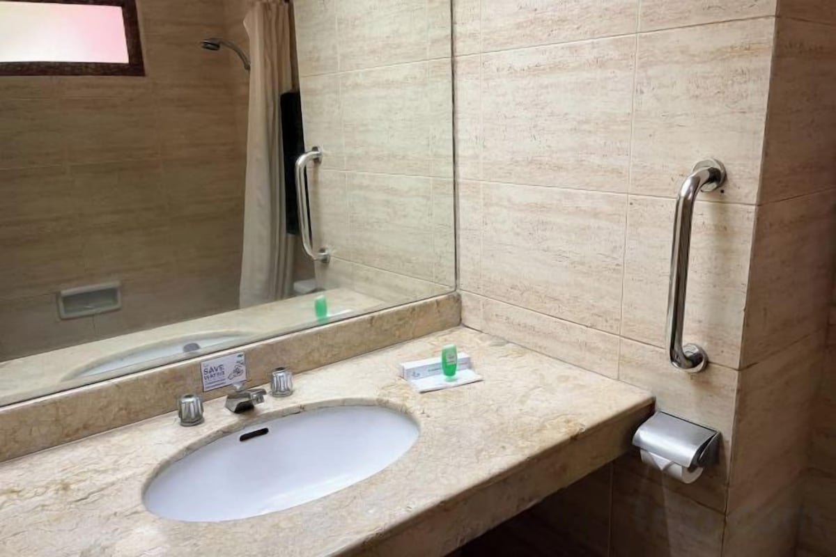 Bathroom | Bathtub, free toiletries, slippers, towels