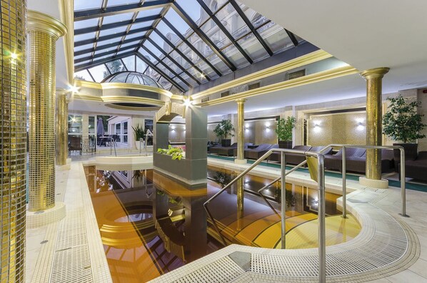 2 indoor pools, seasonal outdoor pool, pool umbrellas, pool loungers