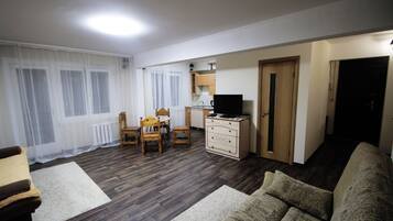 Apartment, 1 Bedroom | Living room | 32-inch flat-screen TV with cable channels, TV