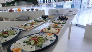 A buffet with various food items arranged on trays. - Bilgehan Hotel (Antalya)