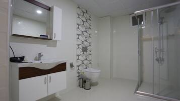 Shower, free toiletries, hair dryer, bathrobes