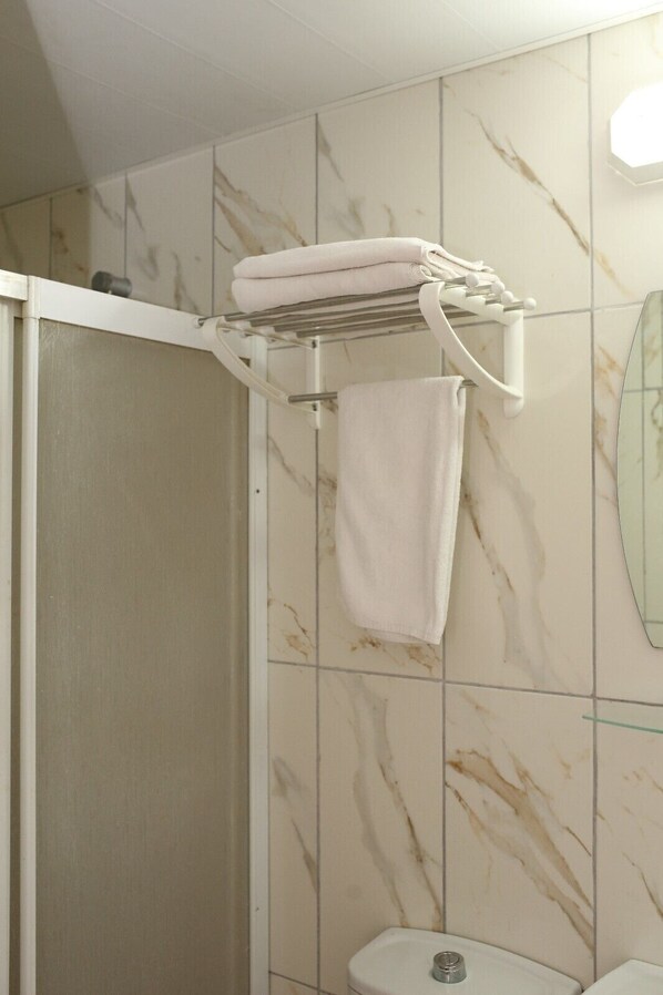 Shower, free toiletries, hair dryer, slippers