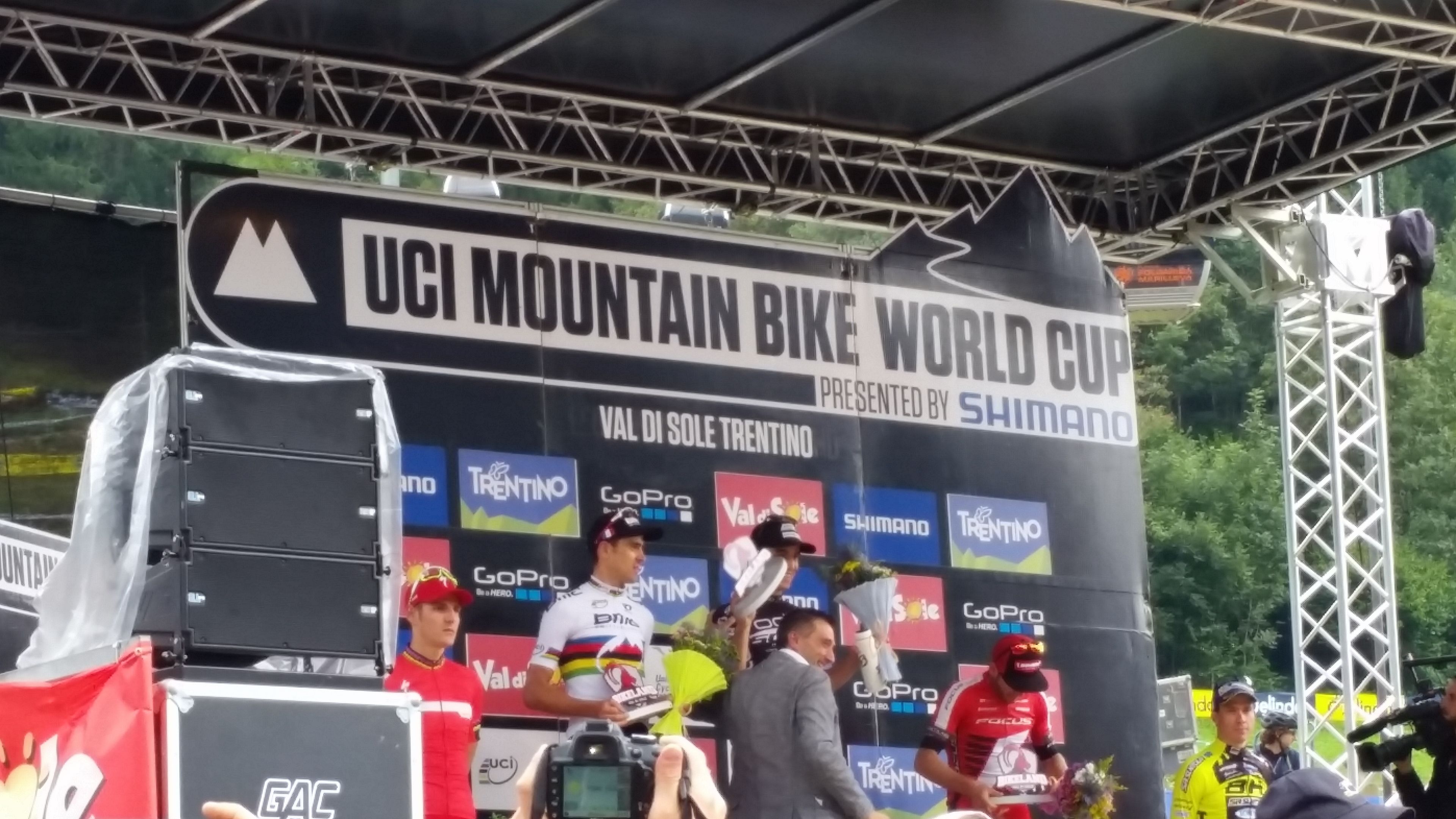 A podium with a sign for the UCI Mountain Bike World Cup.