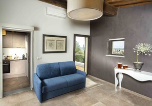 Suite Eksklusif | Area keluarga | Televisi layar datar 32-inci dengan saluran TV satelit dan TV