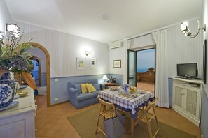 Apartment, 1 Bedroom | Living area | Flat-screen TV