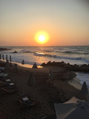 On the beach, sun-loungers