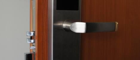 A modern door with a built-in electronic lock and a keyhole.