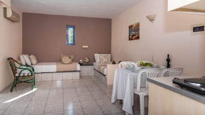Standard Apartment, 1 Bedroom | Living room | 24-inch flat-screen TV with satellite channels, TV, ping pong