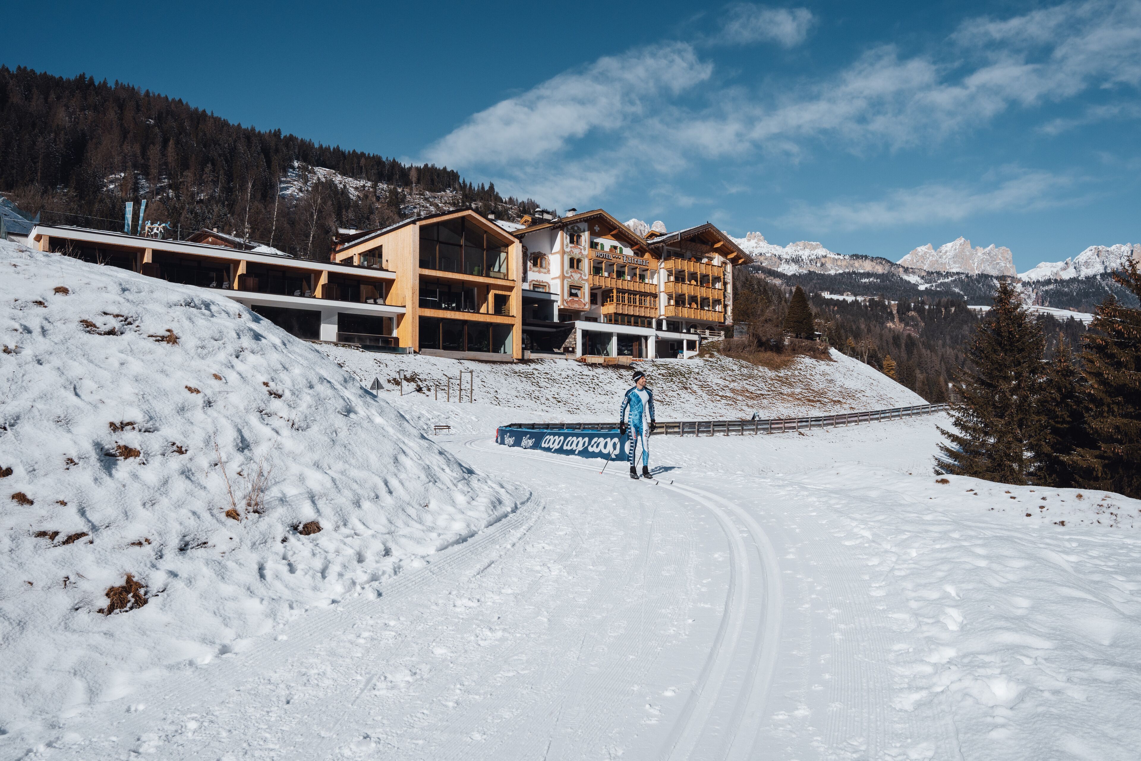 A ski resort with a large lodge and a ski lift.