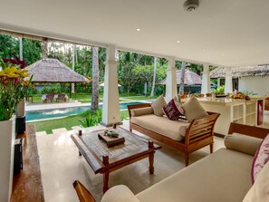 Family Villa | Living area | 32-inch Smart TV with cable channels, DVD player - Villa Gils by Villa Finder (Manggis)