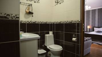 Shower, rainfall showerhead, designer toiletries, hair dryer