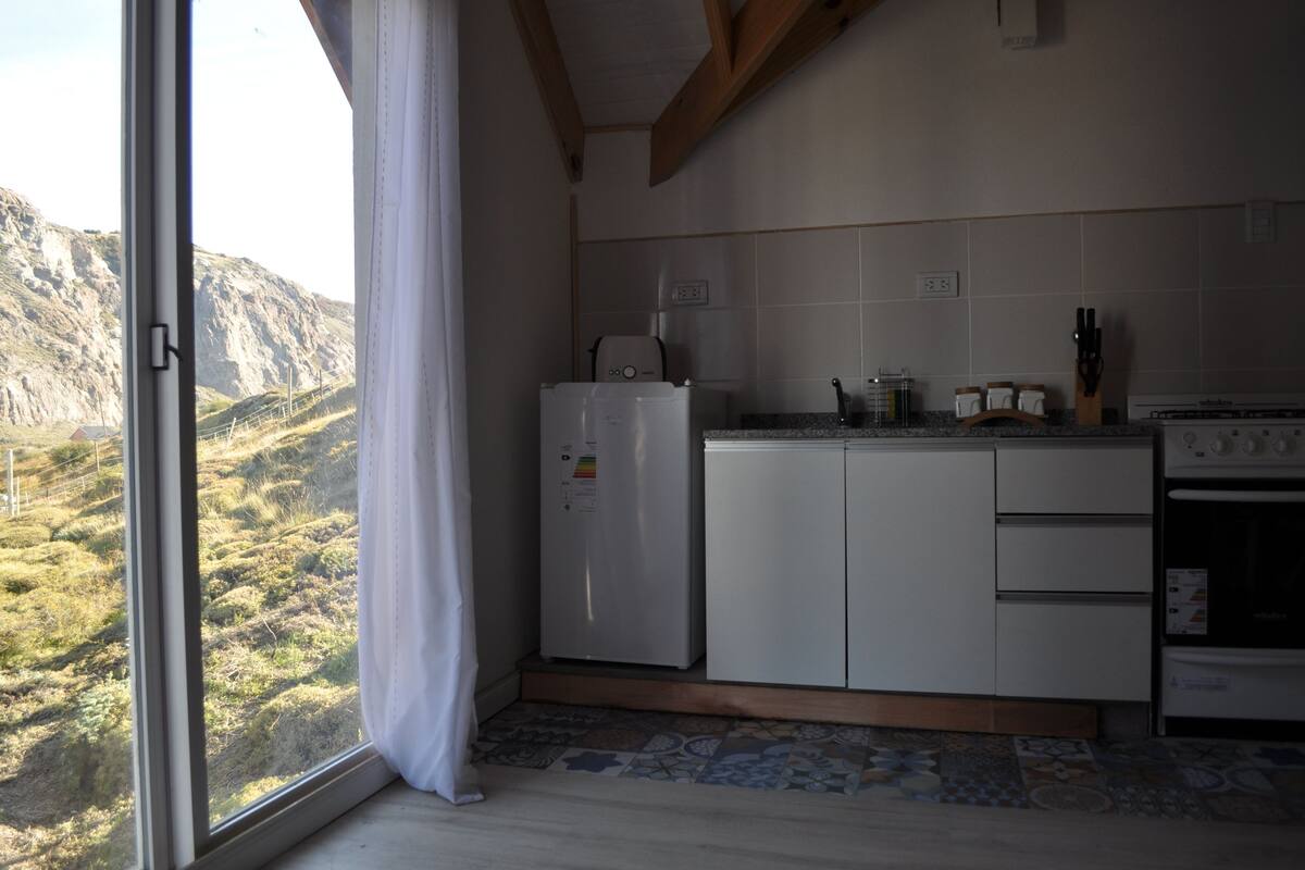 full-sized fridge, microwave, toaster, cookware/dishes/utensils