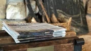A wooden box labeled "U.S. Mail" with a stack of newspapers and a plaque indicating a presentation to Eugene A. Bridges with the United States Mint from 1991-2003.
