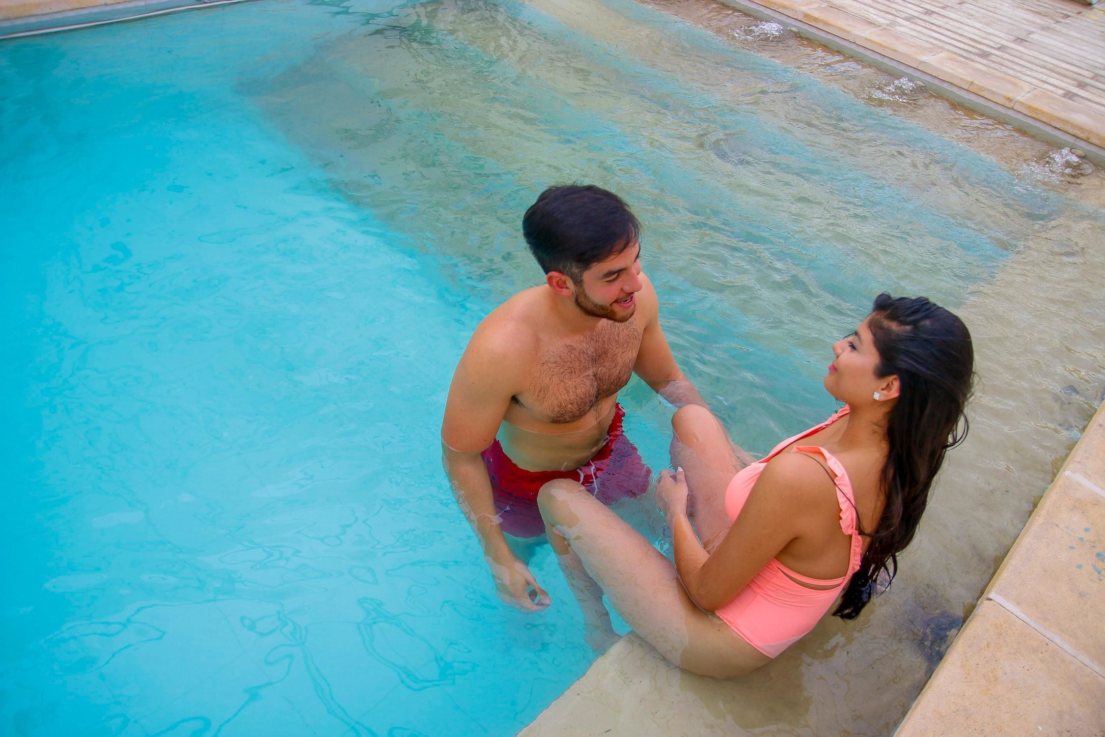 A swimming pool with clear blue water.