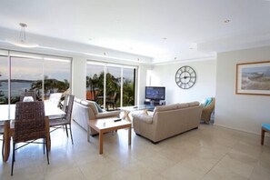 Luxury Apartment, 3 Bedrooms, Partial Sea View | Living area | Flat-screen TV