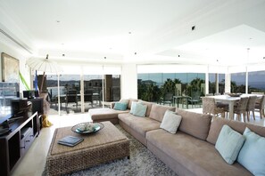 Luxury Apartment, 3 Bedrooms, Ocean View | Living area | Flat-screen TV