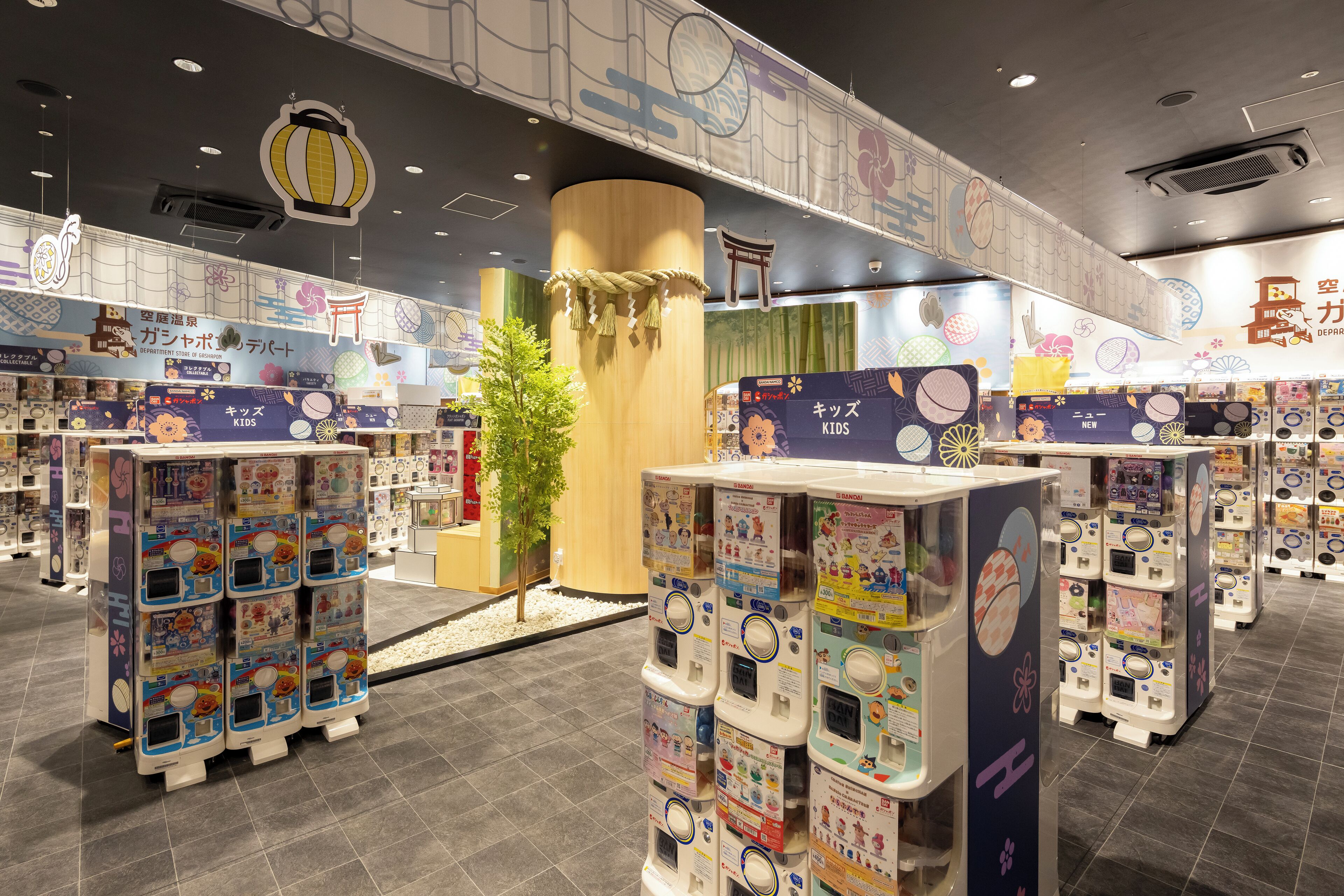 A children's play area with vending machines and colorful decorations.